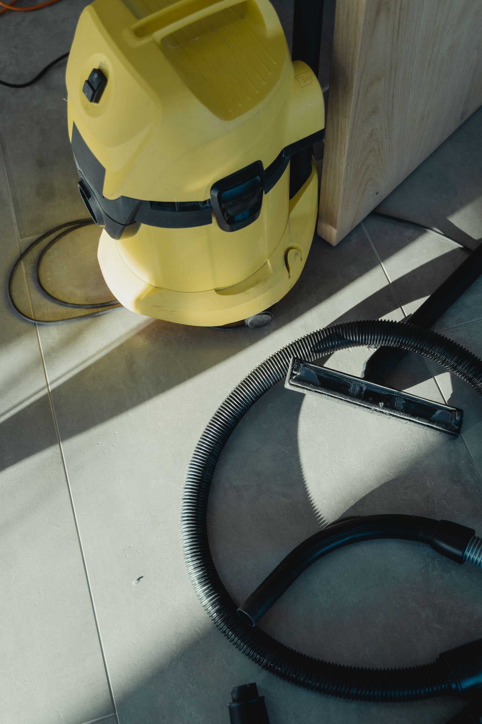 Industrial wet-dry vacuum and hose used for emergency water extraction